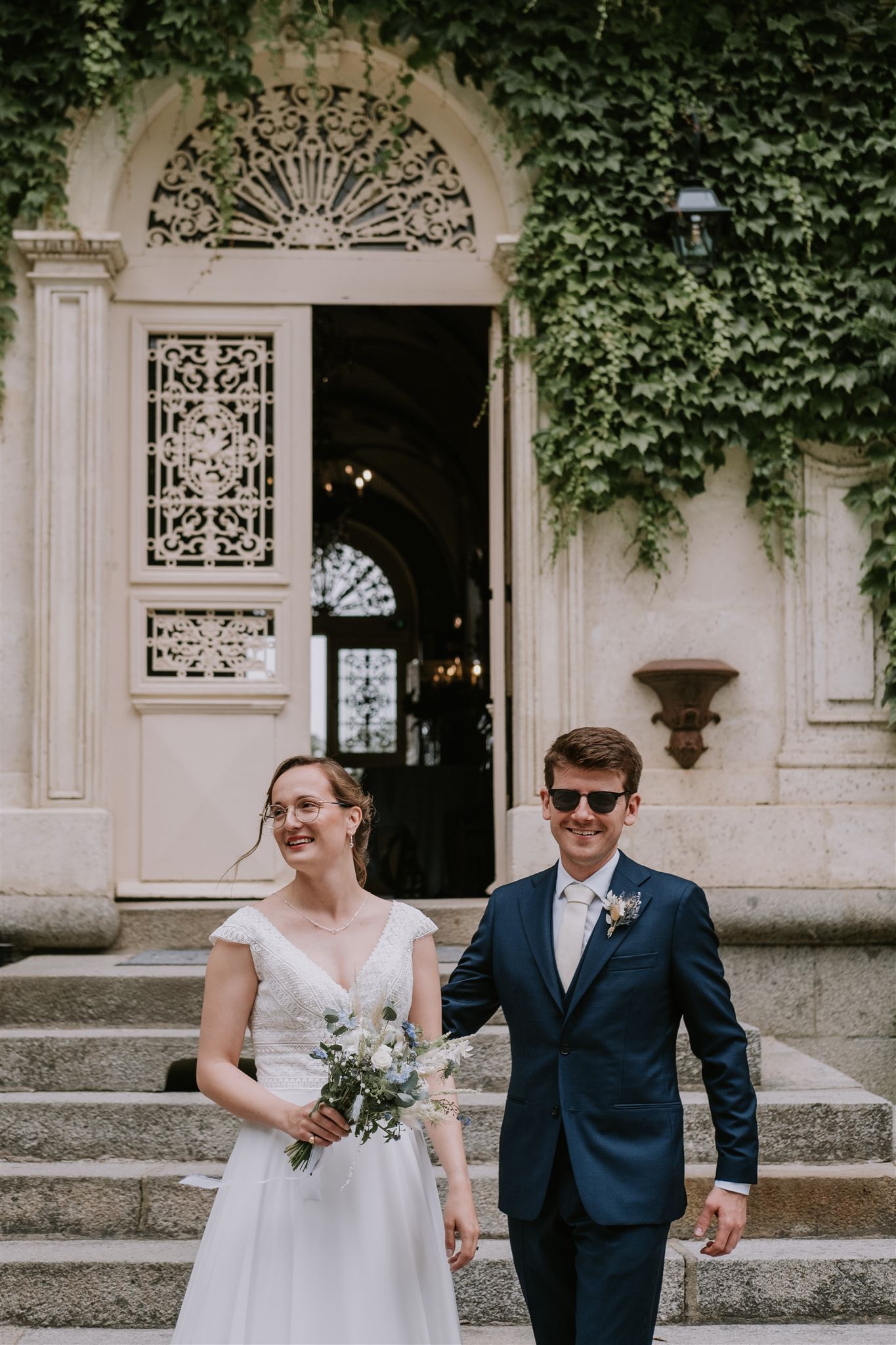 a man and woman in a suit and sunglasses
