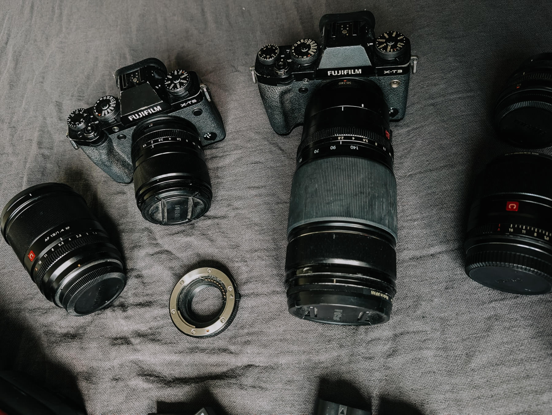 a group of cameras on a blanket